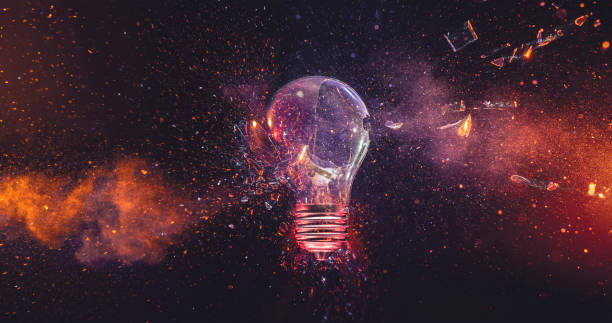istock Light bulb explosion with fiery sparks against a dark backdrop, symbolizing a sudden release of energy and destruction 2187805426