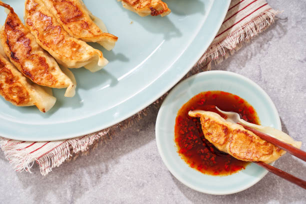 istock Dumplings Commonly Eaten in Japan - Crispy Pan-Fried Gyoza 2187805557