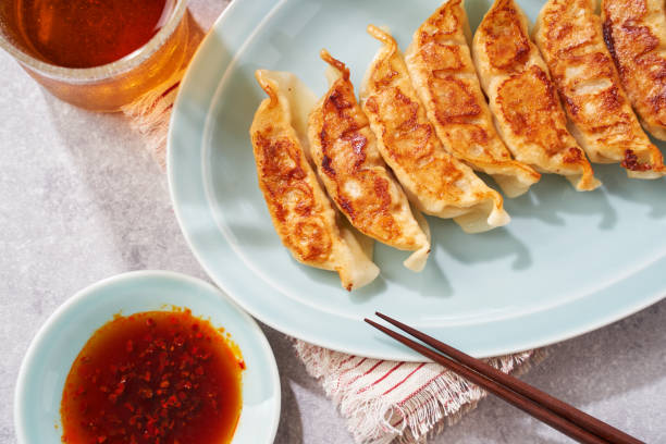 istock Dumplings Commonly Eaten in Japan - Crispy Pan-Fried Gyoza 2187805579