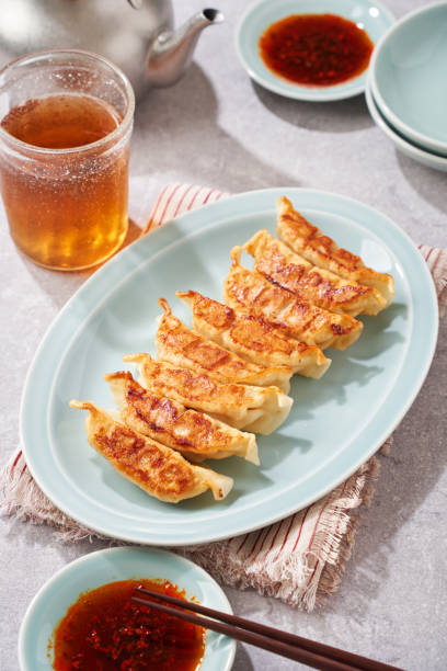 istock Dumplings Commonly Eaten in Japan - Crispy Pan-Fried Gyoza 2187805594
