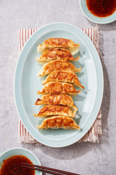 istock Dumplings Commonly Eaten in Japan - Crispy Pan-Fried Gyoza 2187805615