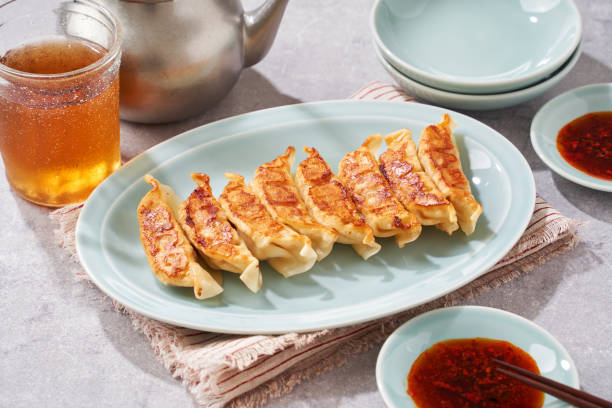 istock Dumplings Commonly Eaten in Japan - Crispy Pan-Fried Gyoza 2187805626