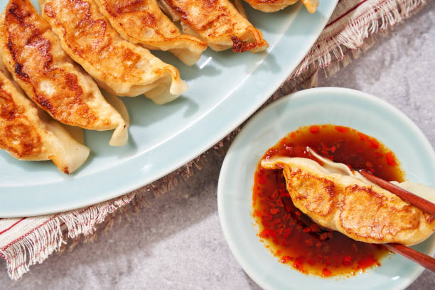 istock Dumplings Commonly Eaten in Japan - Crispy Pan-Fried Gyoza 2187805708