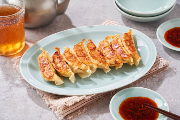 istock Dumplings Commonly Eaten in Japan - Crispy Pan-Fried Gyoza 2187805710
