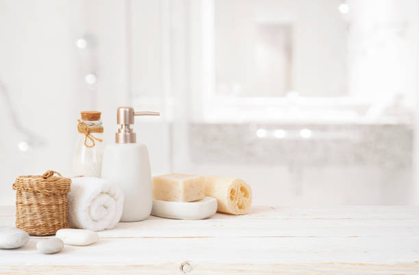 istock Composition with spa toiletries on bleached wooden table with blurred bathroom as background 2187805763