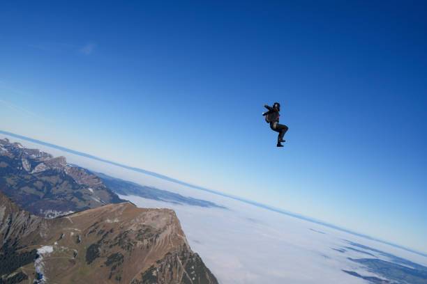 istock Skydiver soars in blue skies 2187805770