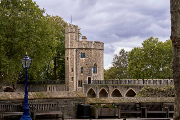 istock Historic stone tower in London with lush trees. 2187806140