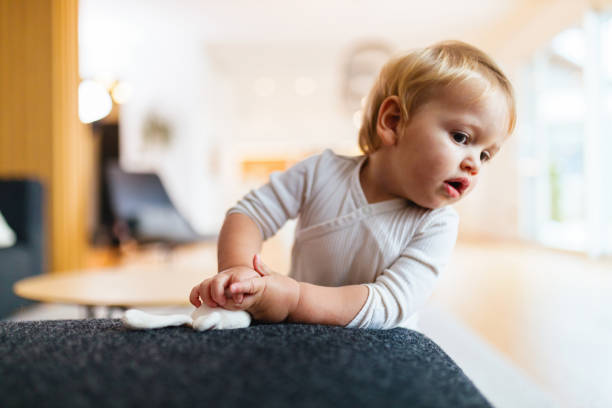 istock Adorable Baby Playing in a Bright Home Interior 2187806300