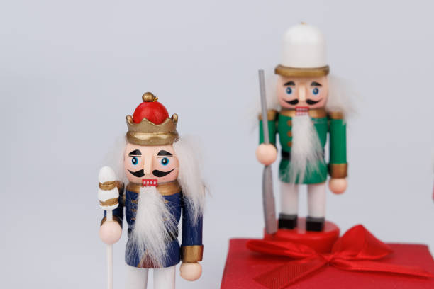 istock Vibrant Nutcracker Display with Original Hair and Red Gift Box on White 2187807056
