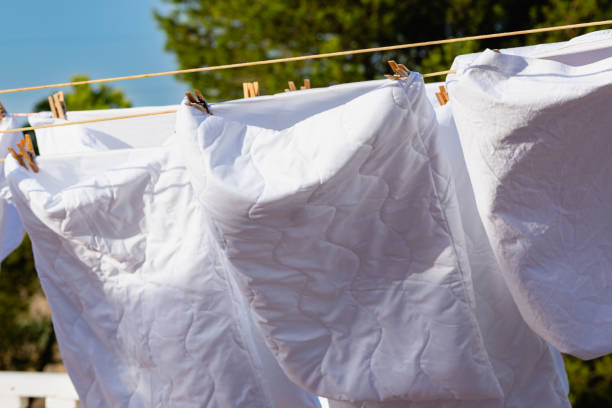 istock Murcia, Spain - 12th August 2024 - White laundry drying in sunlight against a clear blue sky, creating a vibrant atmosphere during a summer day 2187807084