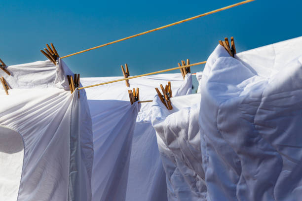 istock Murcia, Spain - 12th August 2024 - White laundry drying in sunlight against a clear blue sky, creating a vibrant atmosphere during a summer day 2187807678