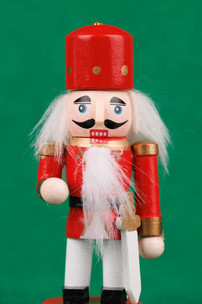 istock Whimsical Nutcracker with Original Hair and Holiday Elements on a Bright Green Background 2187807750
