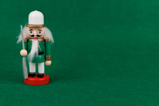 A charming wooden nutcracker with original hair is beautifully set against a rich green backdrop, adding a touch of holiday spirit