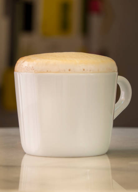 a cup of cocoa on a saucer on the table