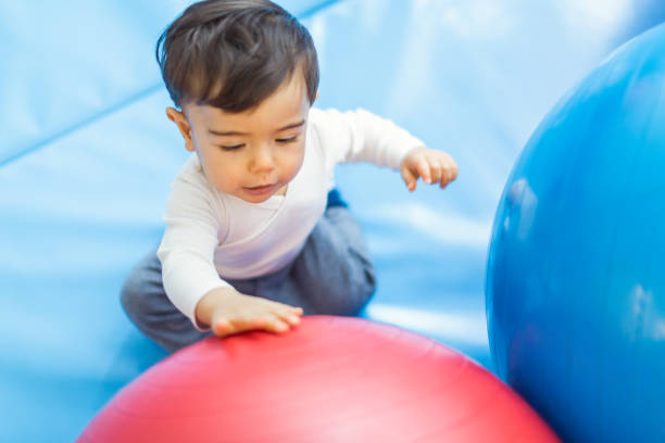 istock Joyful Toddler Engaging with Colorful Balls 2187808362