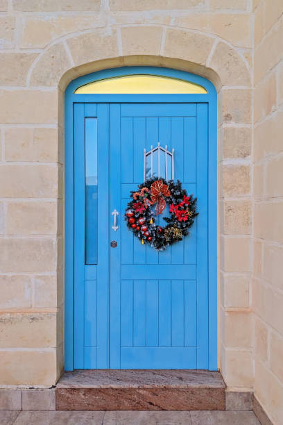 istock Vibrant Blue Door with Festive Christmas Wreath 2187808691