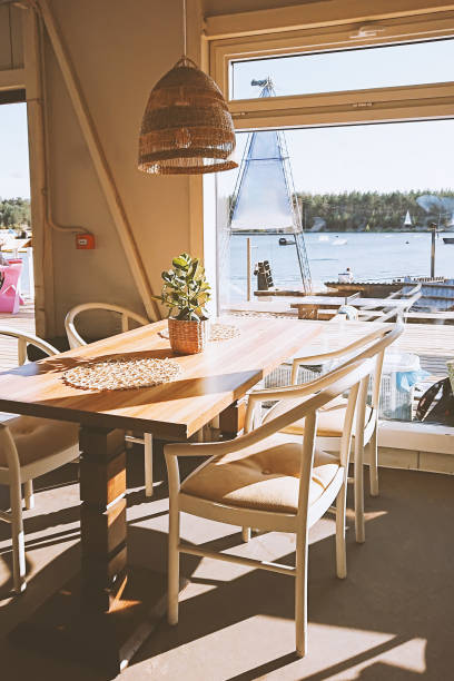 istock Bright Cafe Interior Overlooking a Scenic Lake 2187808719