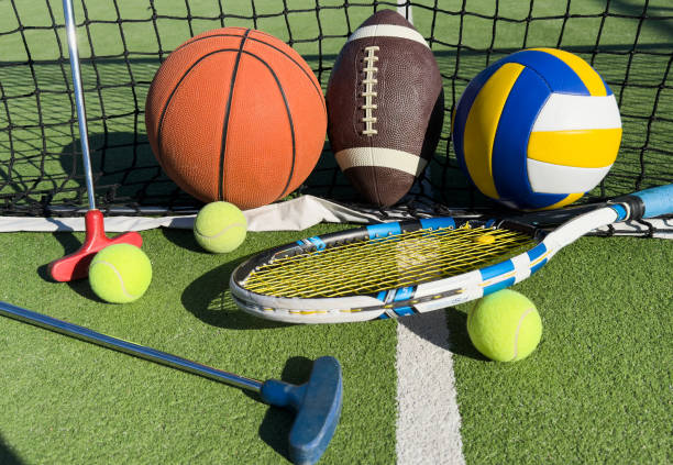 istock Different sport equipment on green grass, flat lay. Space for text 2187808773