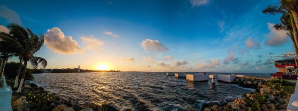 istock Stunning coastal sunset view with palm trees and clear blue sky. 2187808977