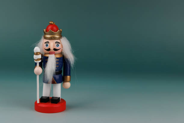 A beautifully crafted wooden nutcracker stands proudly, showcasing its original hair and festive decorations, perfect for holiday cheer
