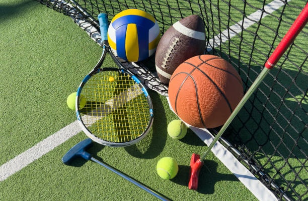 istock Different sport equipment on green grass, flat lay. Space for text 2187810076