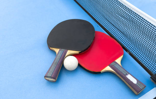 istock table tennis or ping pong racket and balls on a blue table 2187810365