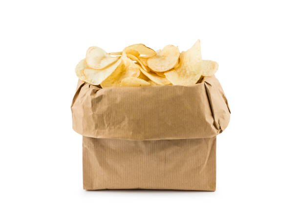 Brown paper bag full of potato chips on white background.