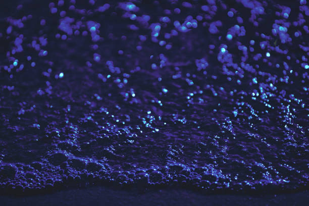 Purple blue spilling abstract foam wave of liquid, plastic, water