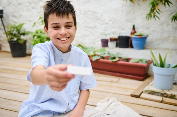 Boy holding a card