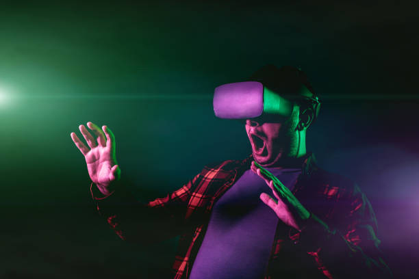 istock Mid-Adult Man Playing A Scary Virtual Reality Game 2187819287