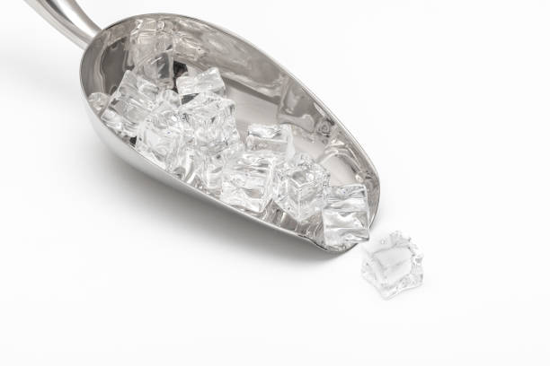 istock Metal Bar Ice Shovel Holding Ice Cubes on White 2187821764