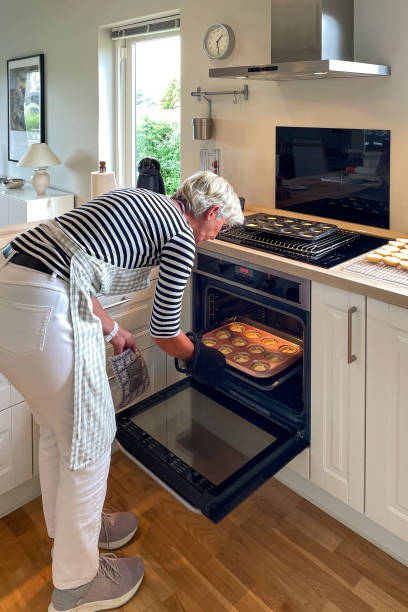 istock Woman in the kitchen baking cakes 2187826407