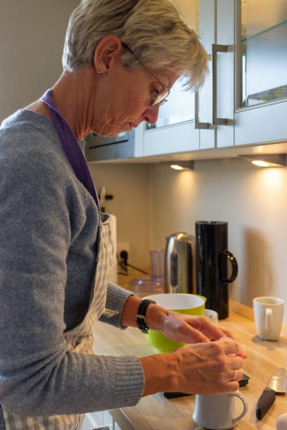 istock person preparing food in kitchen 2187826417