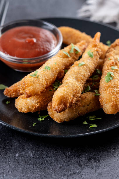 istock Breaded Torpedo shrimps on black slate background 2187826871