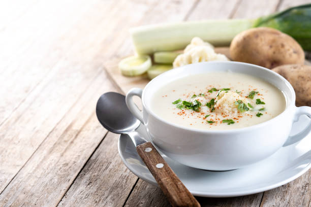 istock Cauliflower soup in bowl on wooden table 2187826941
