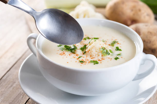 istock Cauliflower soup in bowl on wooden table 2187826976