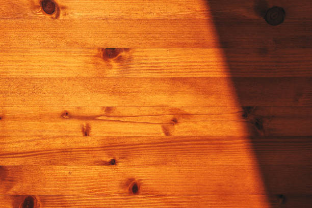 istock Surface of a wooden desk top with shadow and light 2187827919