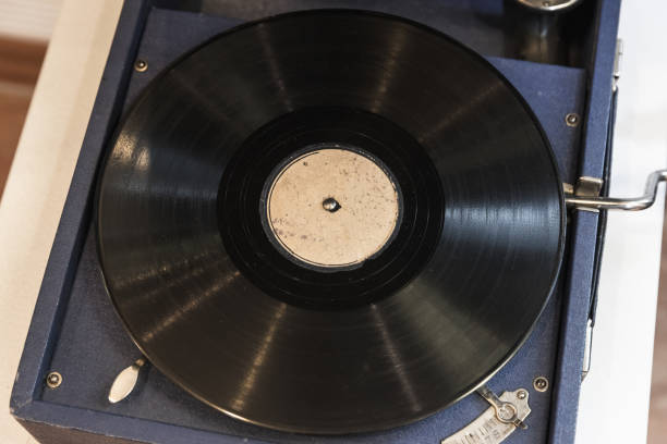 istock Blue vintage phonograph with black vinyl record, top view, 2187828808