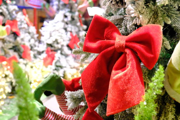istock Christmas celebrations, snow-covered pine trees and sparkling gift boxes 2187829407