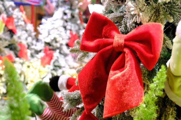 istock Christmas celebrations, snow-covered pine trees and sparkling gift boxes 2187829487
