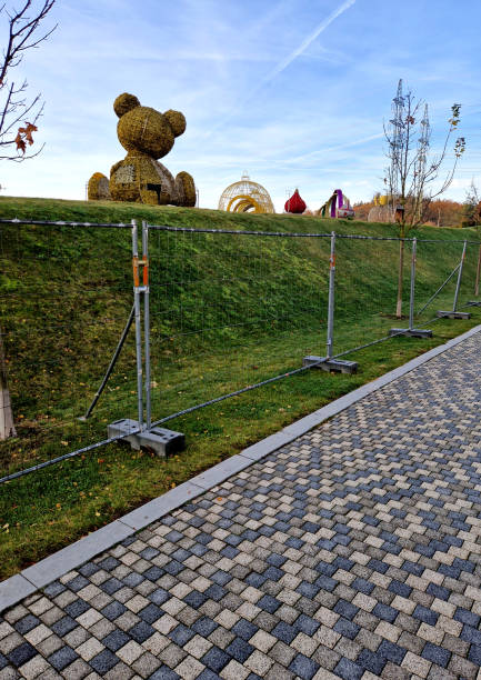 istock light effects in an amusement park from led lighting stretched over wire skeletons and grassy hills. kilometers of cables. mobile fencing 2187833034