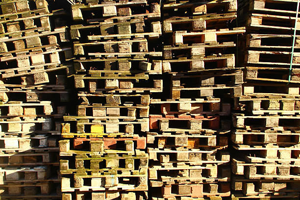 Stacks of wooden pallets in a warehouse