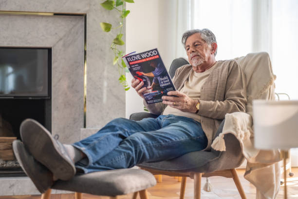 istock Relaxed Senior Man Reading a Magazine in a Cozy Setting 2187834659