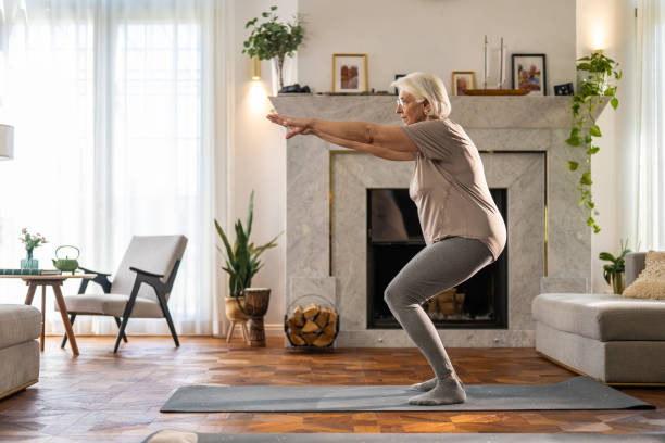 Senior Woman Practicing Squats for Balance and Strength at home