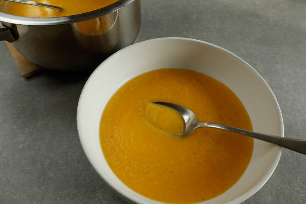 istock bowl of creamy vegetable soup with spoon 2187838967