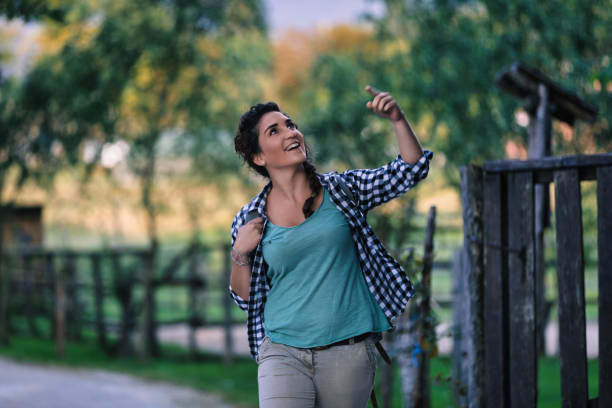 istock Young tourist walking and pointing at something while exploring the countryside 2187841186