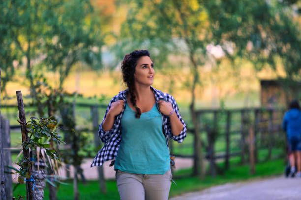 istock Female farmer walking and smiling in farm 2187841504