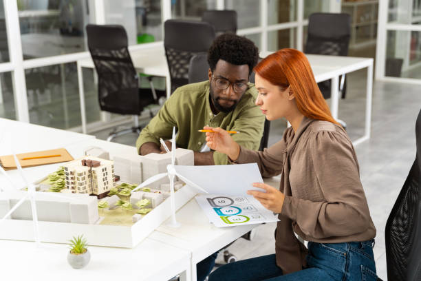 istock Two young architects working together on a new sustainable project 2187844630