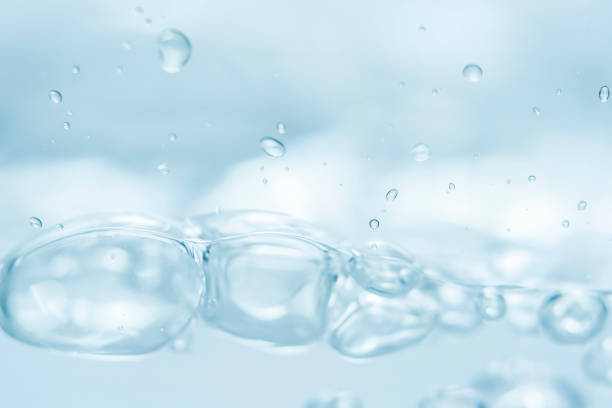 istock Empty background with bubbles in slight blur at high magnification. Background with close-up of drinking water in soft focus. 2187846770