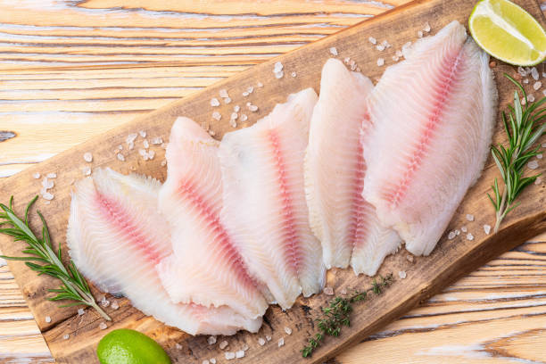 istock Raw tilapia fillet photography . Top view 2187848025